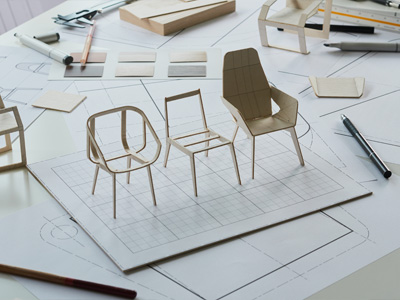 Drafts of chairs and tiny models of chairs