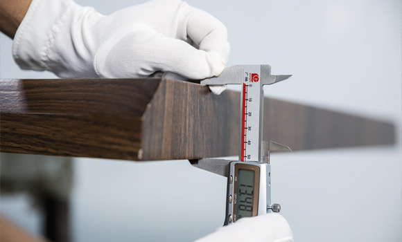 Worker is  measuring MDF board