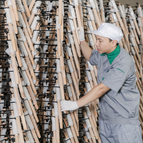 Workers are stacking wooden legs