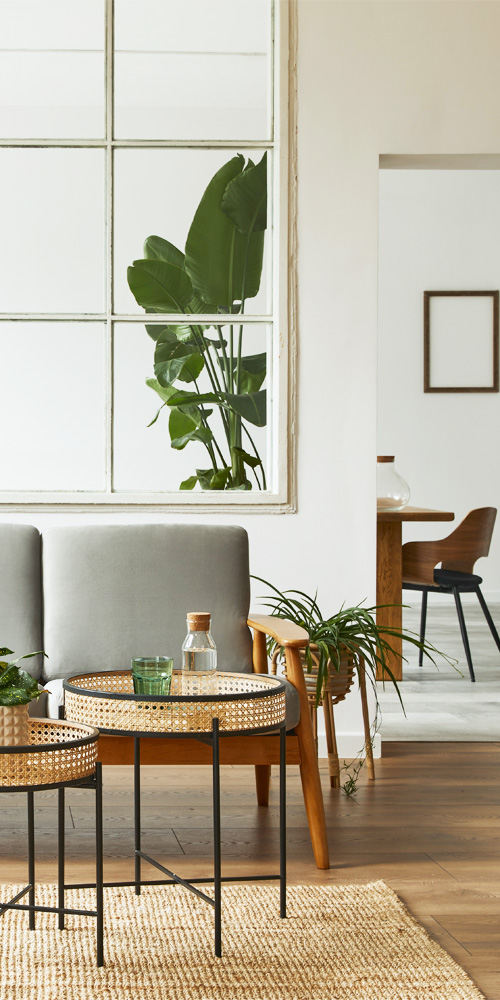 Sofa with wooden armrest in a room