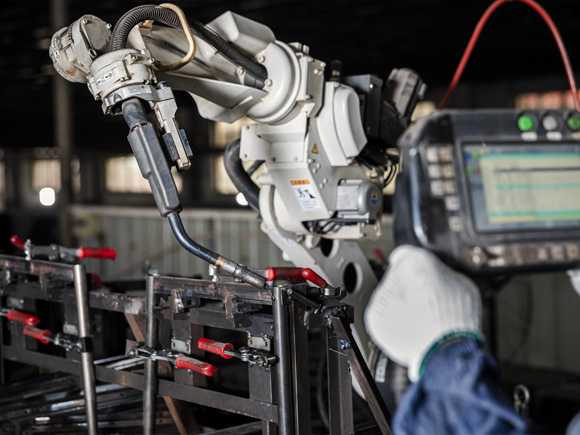 Engineer is handling the robot to prototype