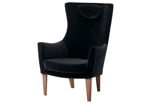 A black wingback armchair