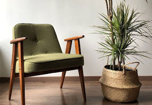 A green mid century armchair