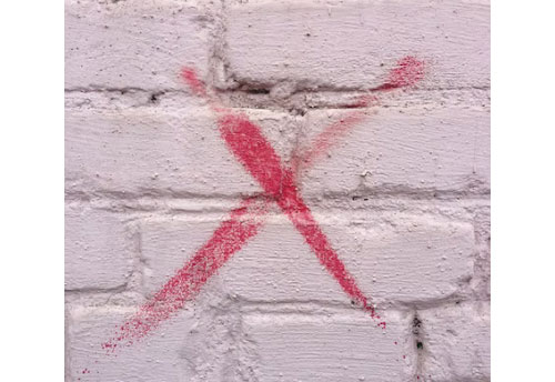 X mark on Wall